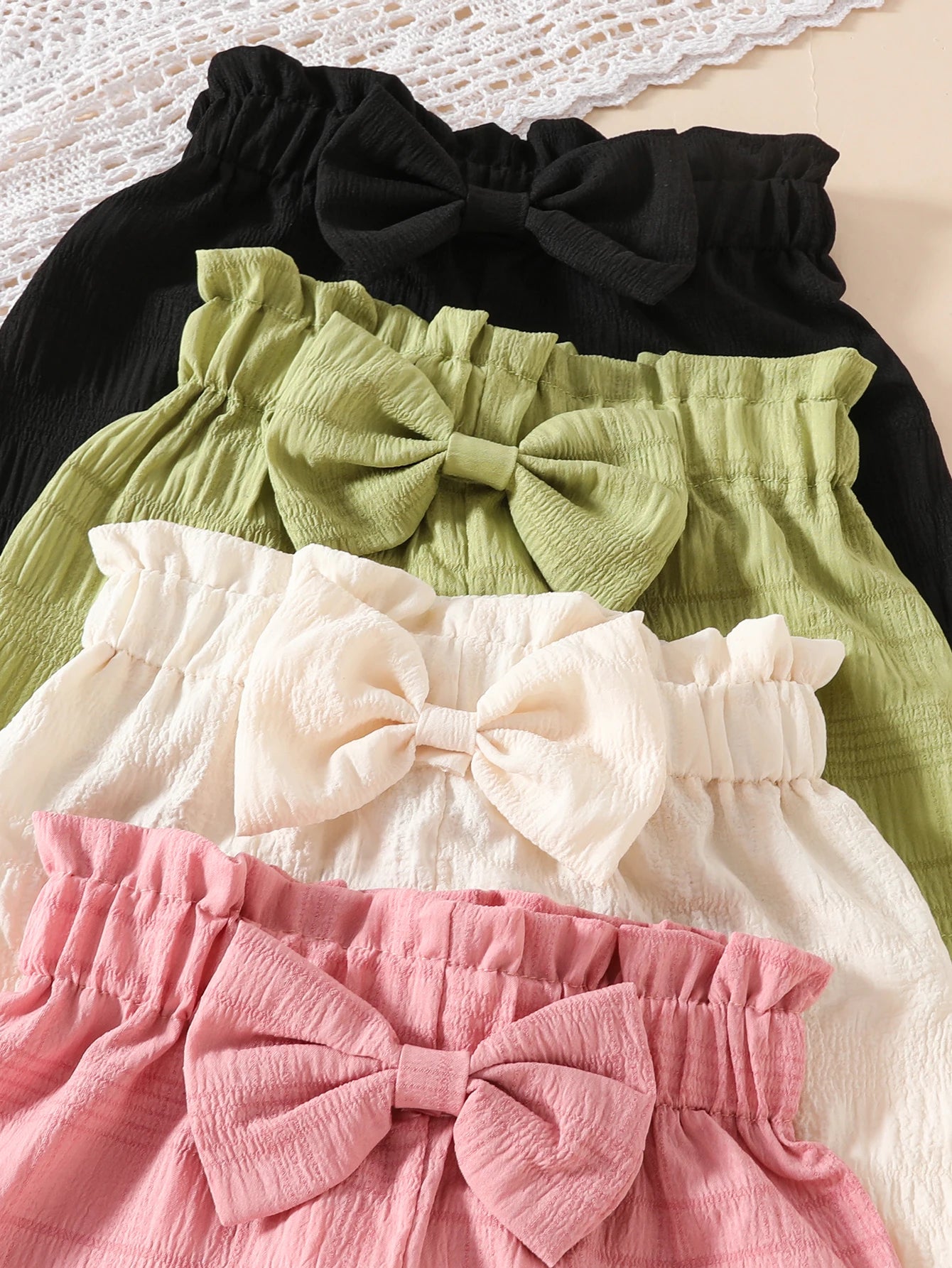 4pcs Girls' Casual Solid Color Polyester Shorts with 3D Bow Detail, Regular Fit Woven Fabric for Spring/Summer - 95% Polyester,